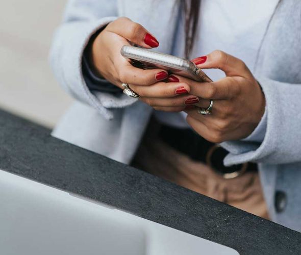 a person looking for an online resources on his phone